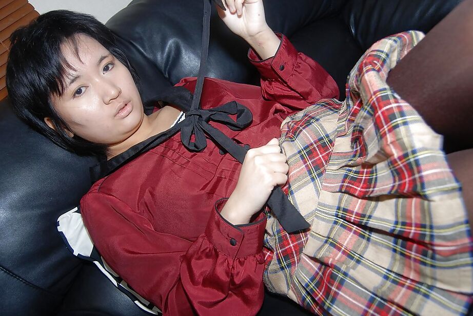 16P Short-haired asian chick in pantyhose undressing and exposing her twat