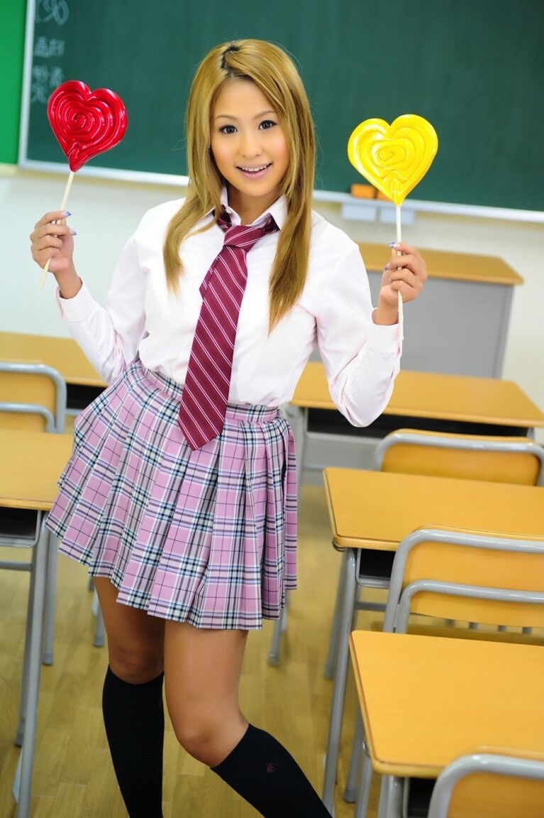 12P Cute Japanese schoolgirl flashes crotchless upskirt panties in a classroom