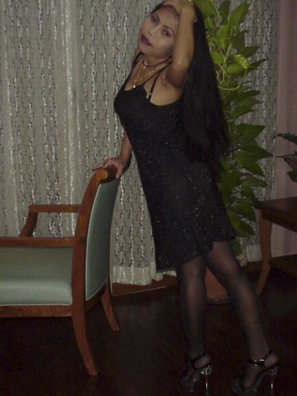 16P Filthy asian babe in leather dress stripping and playing with a huge toy