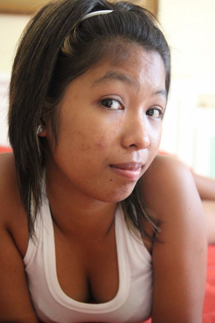 15P Tiny Asian girl Trixie removes red thong to model totally naked