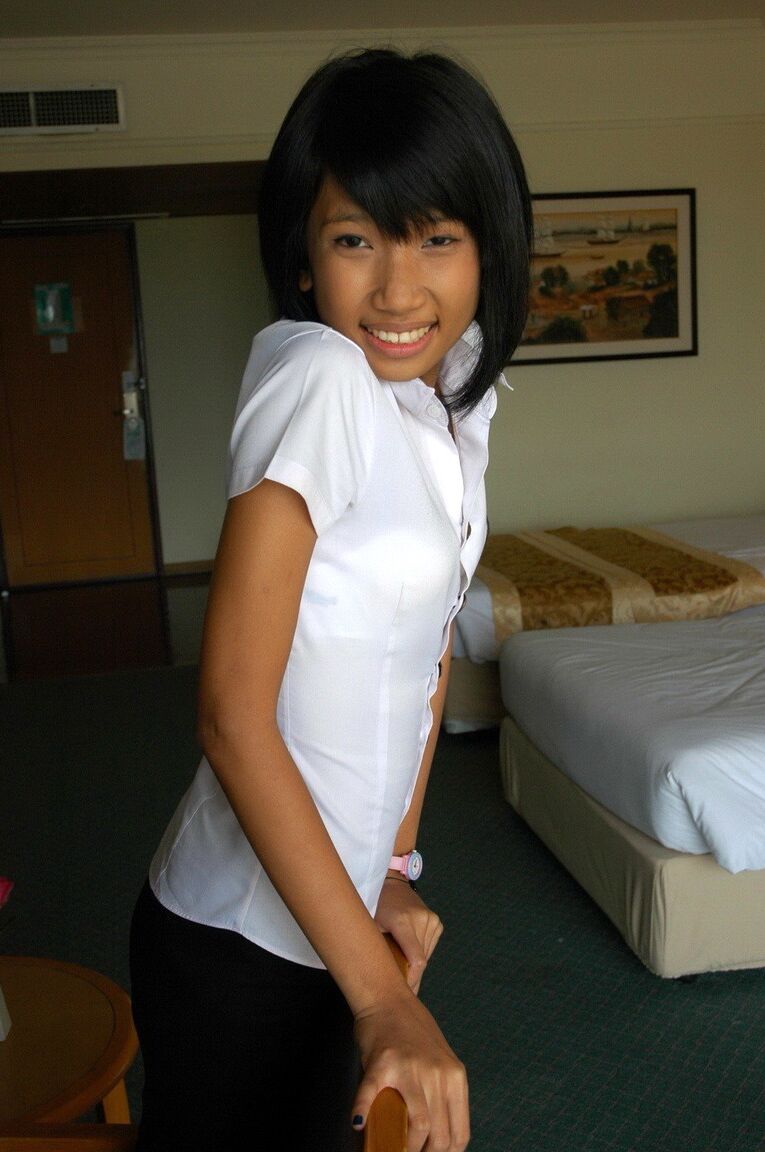 16P Young Asian girl smokes a cigarette before making her nude modeling debut