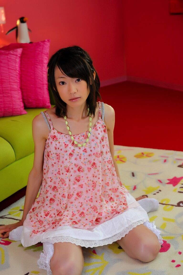 12P Petite Japanese girl with a pretty face models non nude in knee socks