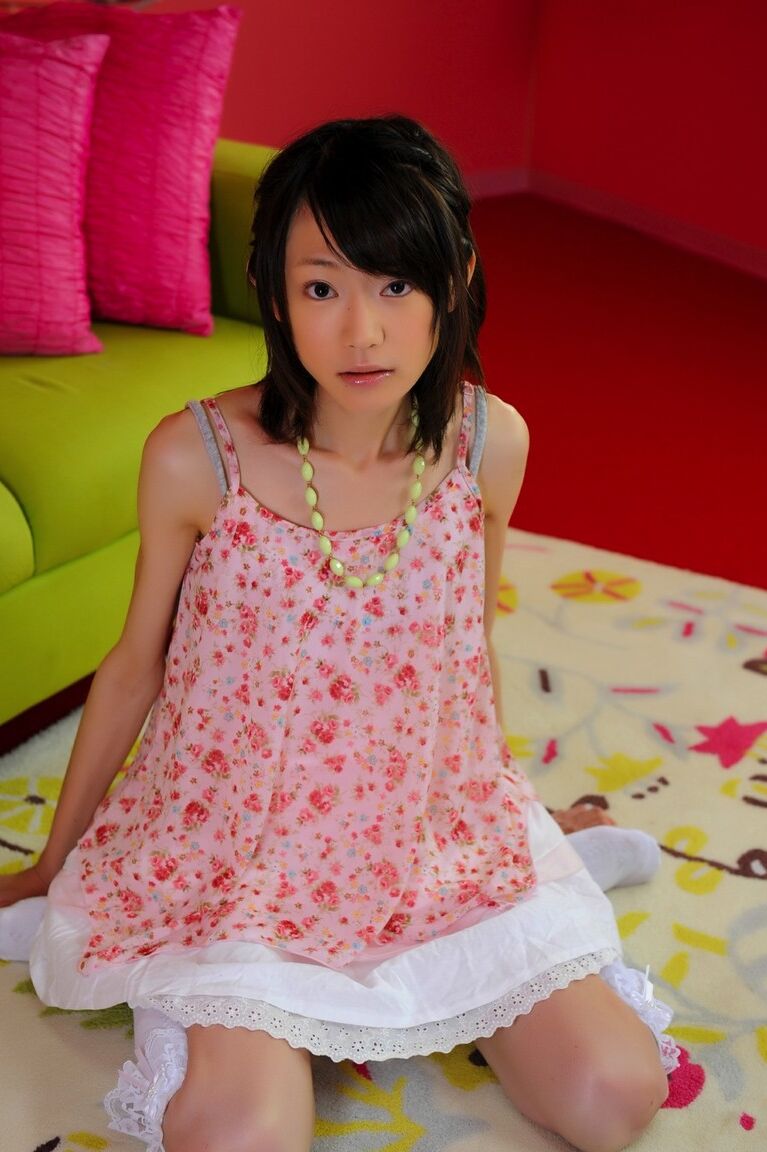 12P Petite Japanese girl with a pretty face models non nude in knee socks