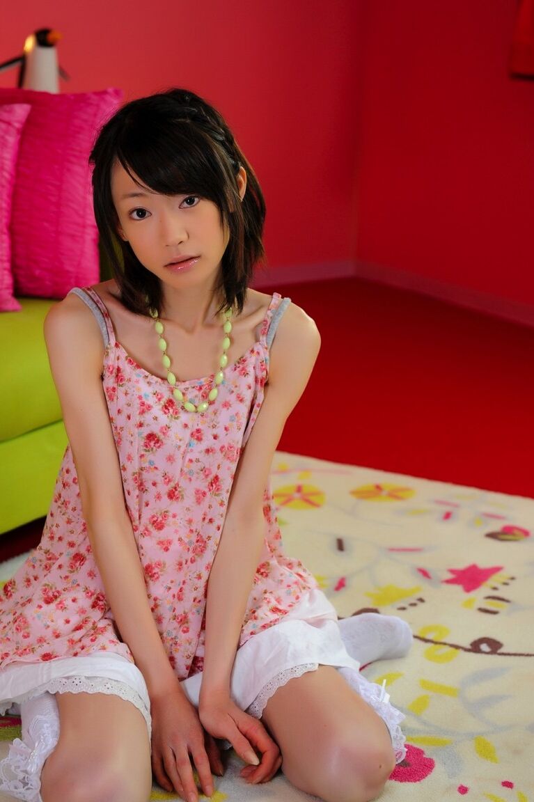 12P Petite Japanese girl with a pretty face models non nude in knee socks
