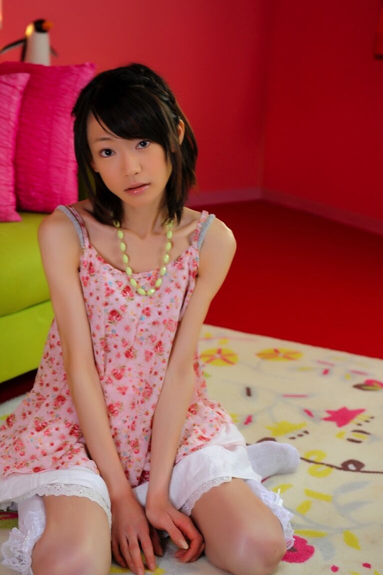 12P Petite Japanese girl with a pretty face models non nude in knee socks