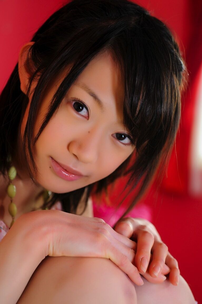 12P Petite Japanese girl with a pretty face models non nude in knee socks