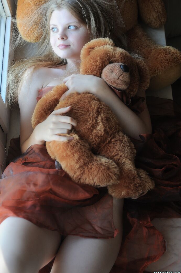 20P Tiny teen Kisa strikes tempting nude poses while holding a teddy bear