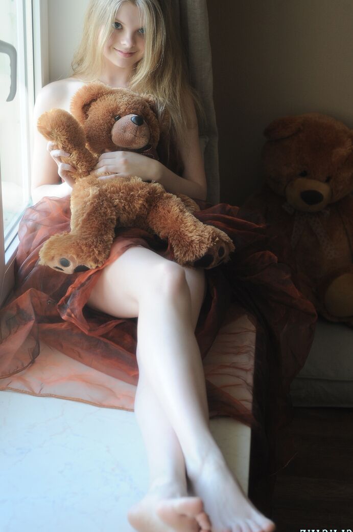 20P Tiny teen Kisa strikes tempting nude poses while holding a teddy bear
