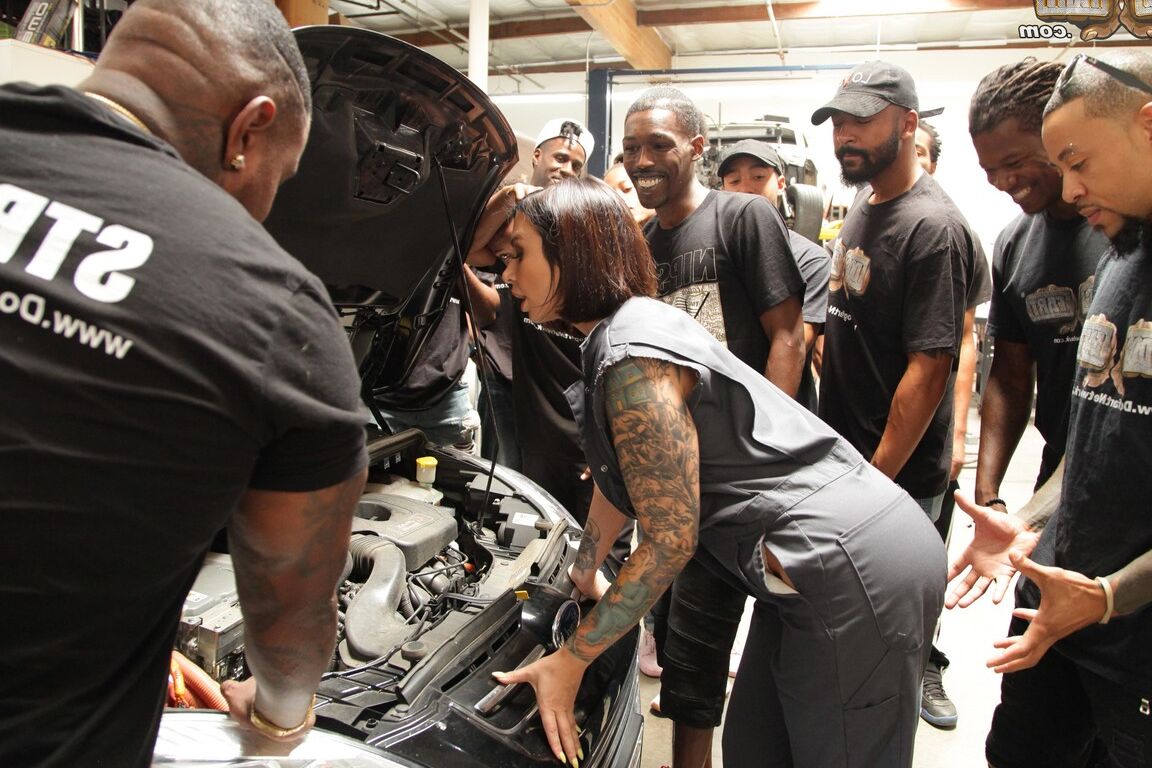 15P Tattooed white chick with enhanced tits sucks off a group of black men