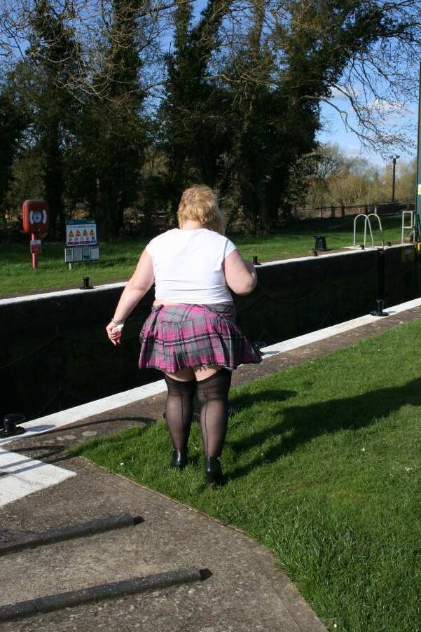 19P Obese blonde Lexie Cummings sports a butt plug while pissing in a parking lot