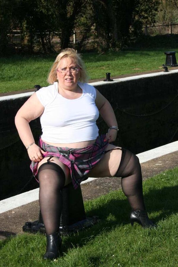 19P Obese blonde Lexie Cummings sports a butt plug while pissing in a parking lot