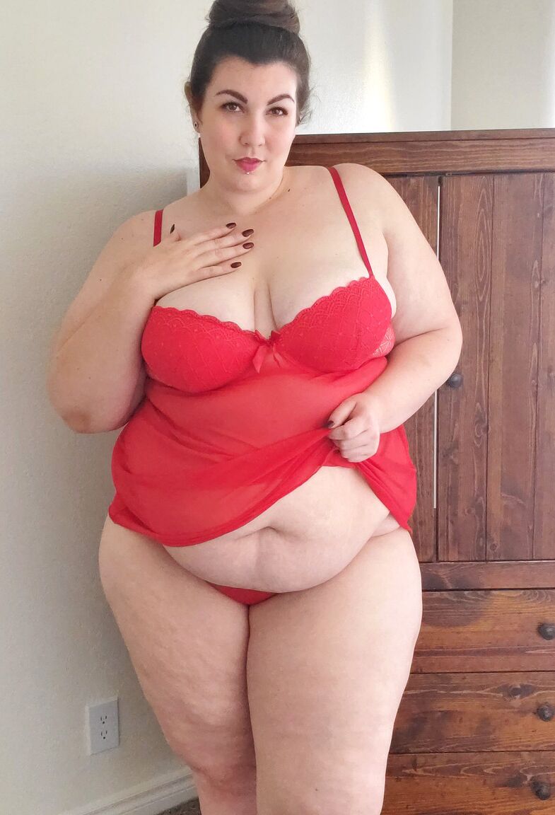 15P Fatty in a red negligee Lady Sublime flaunts her big juggs while sucking a toy