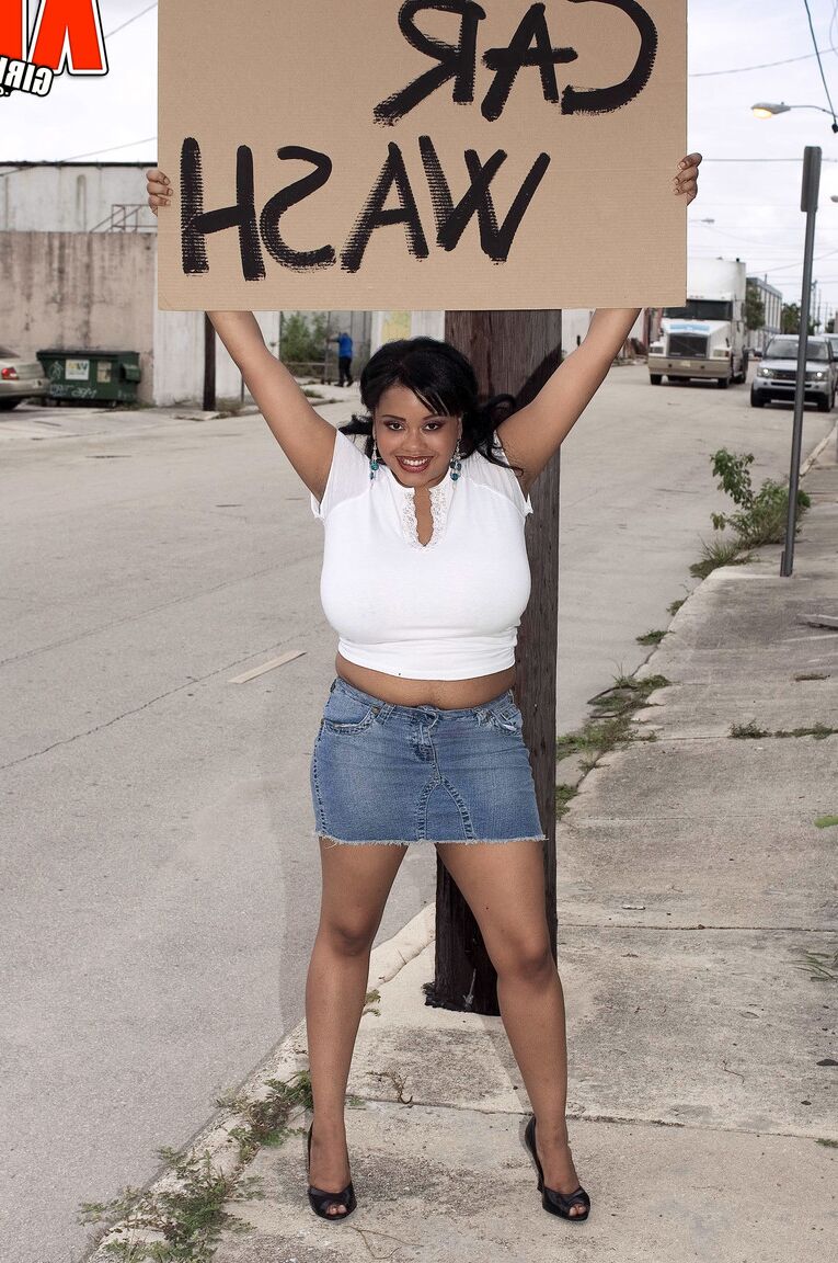 17P Black BBW Sunny Dee soaps up her massive boobs while running a car wash