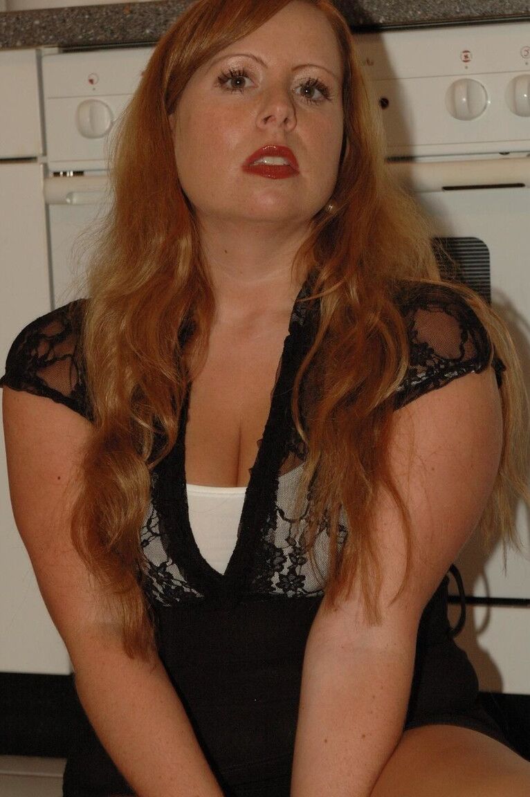 12P Chubby redhead Benita stripping out of her black dress in the