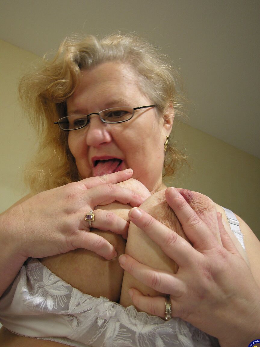 21P Fat grandma Annemarie strips and rubs her devastated pink cunt on a bed