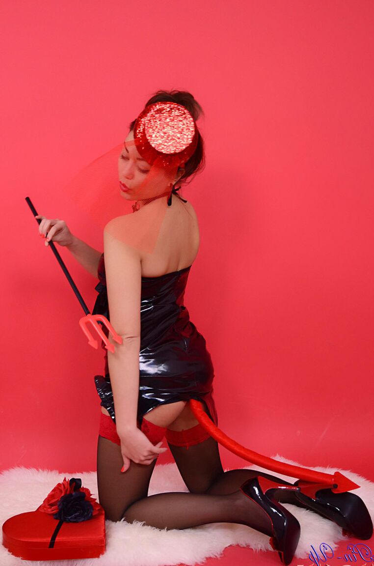17P Cute brunette in latex, corset and stockings, shows us her wicked side