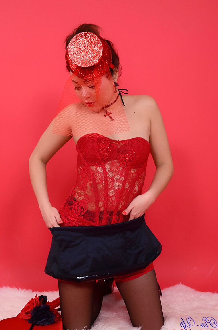 17P Cute brunette in latex, corset and stockings, shows us her wicked side