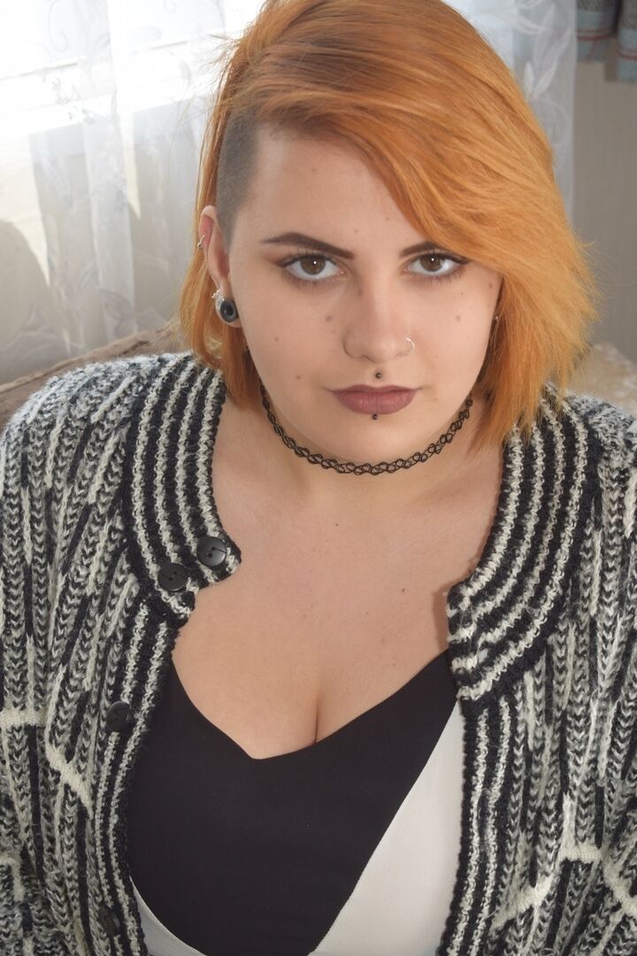 20P Fat redhead Phillipas Ladies stands naked after disrobing on a couch