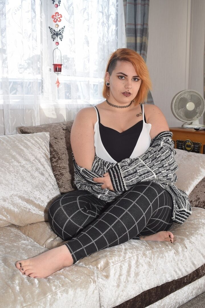 20P Fat redhead Phillipas Ladies stands naked after disrobing on a couch