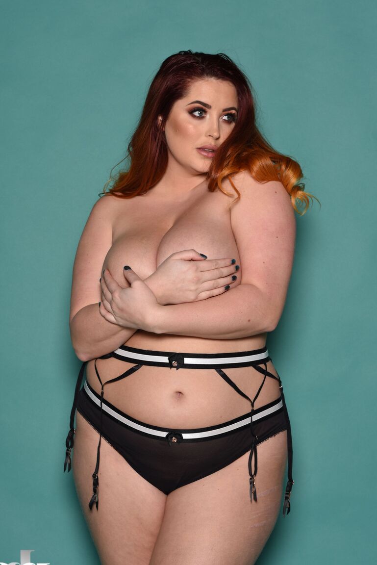 21P Plump British redhead Lucy Vixen flaunts her all natural phenomenal boobs