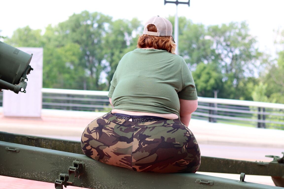 12P Obese amateur Goddess Pear models for a SFW shoot on an artillery gun in camo