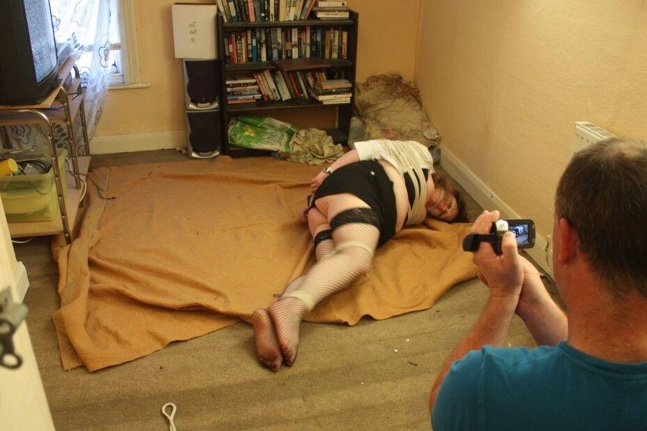 16P Fat woman is rendered helpless by the maintenance man before being tied up