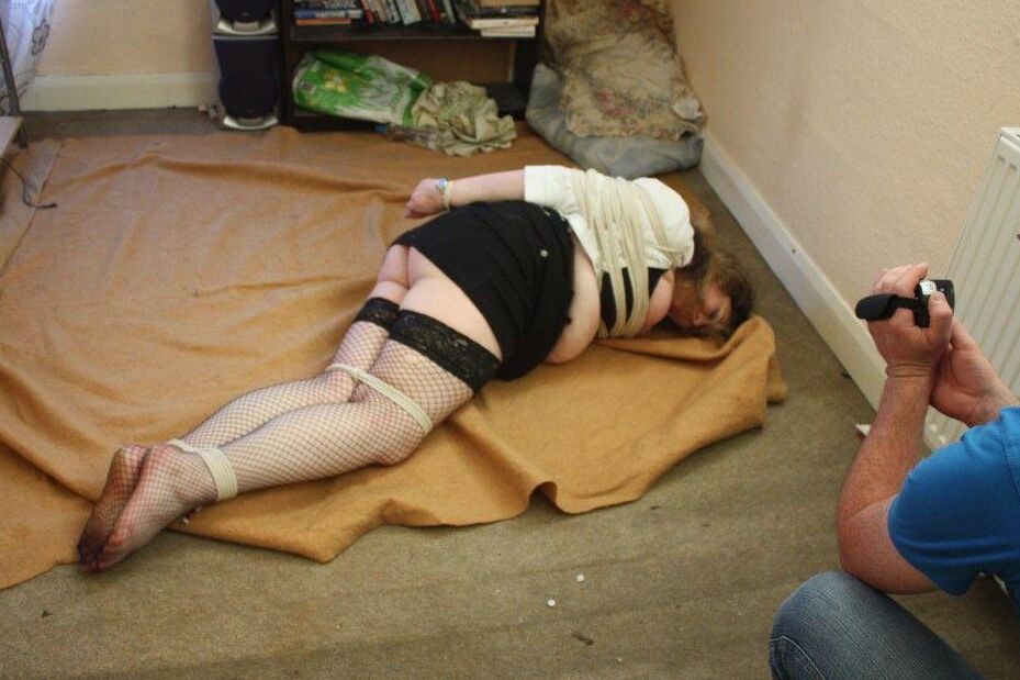 16P Fat woman is rendered helpless by the maintenance man before being tied up