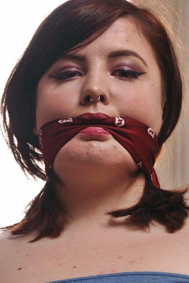16P Tattooed plumper is silenced with a cleave gag while tied to a folding chair