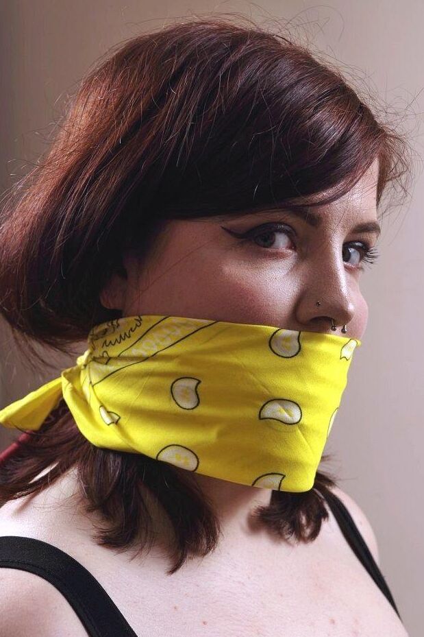 16P Tattooed plumper is silenced with a cleave gag while tied to a folding chair