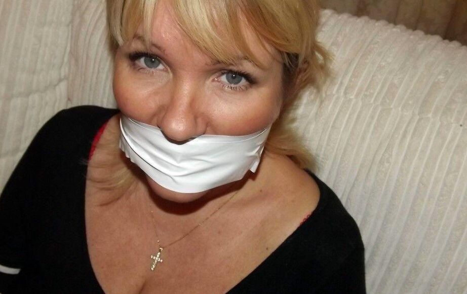 16P Fat older blonde displays her large tits while tied up and cleave gagged