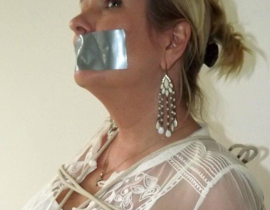 16P Blonde woman is silenced with duct tape while her tits are bound with rope
