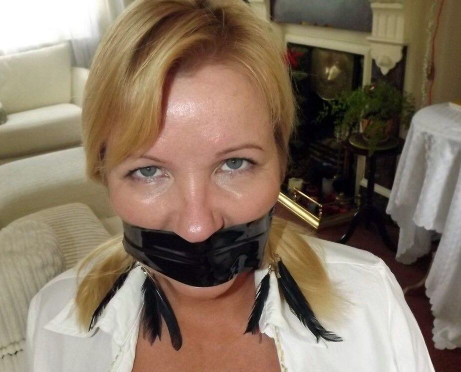 16P Blonde woman is silenced with duct tape while her tits are bound with rope