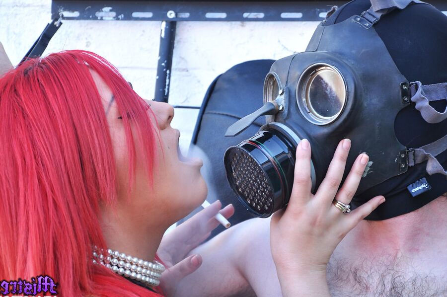 15P Mistress Jemstone hits guy in a gasmask then chains his cock