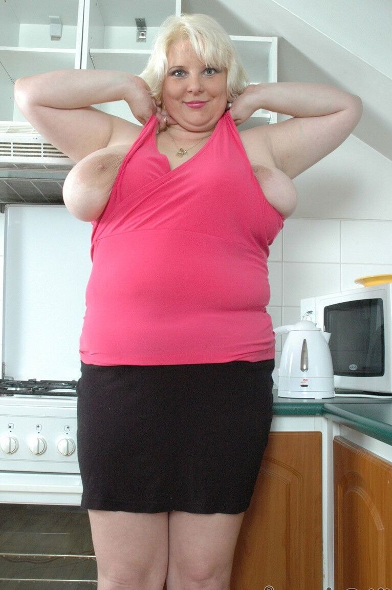 21P Blonde chubby mature June Kelly lets out her huge tits and milks them in a cup