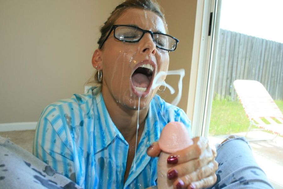 12P Clothed woman Stacie Starr catches cum in her mouth while jerking a cock
