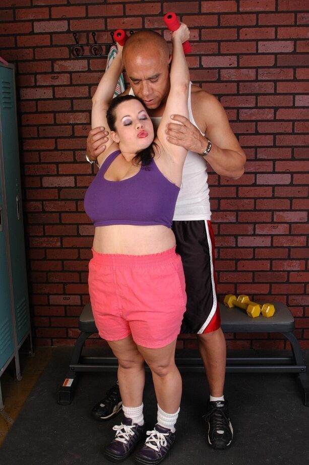 16P Older fat chick with huge hanging tits gets felt up while working out
