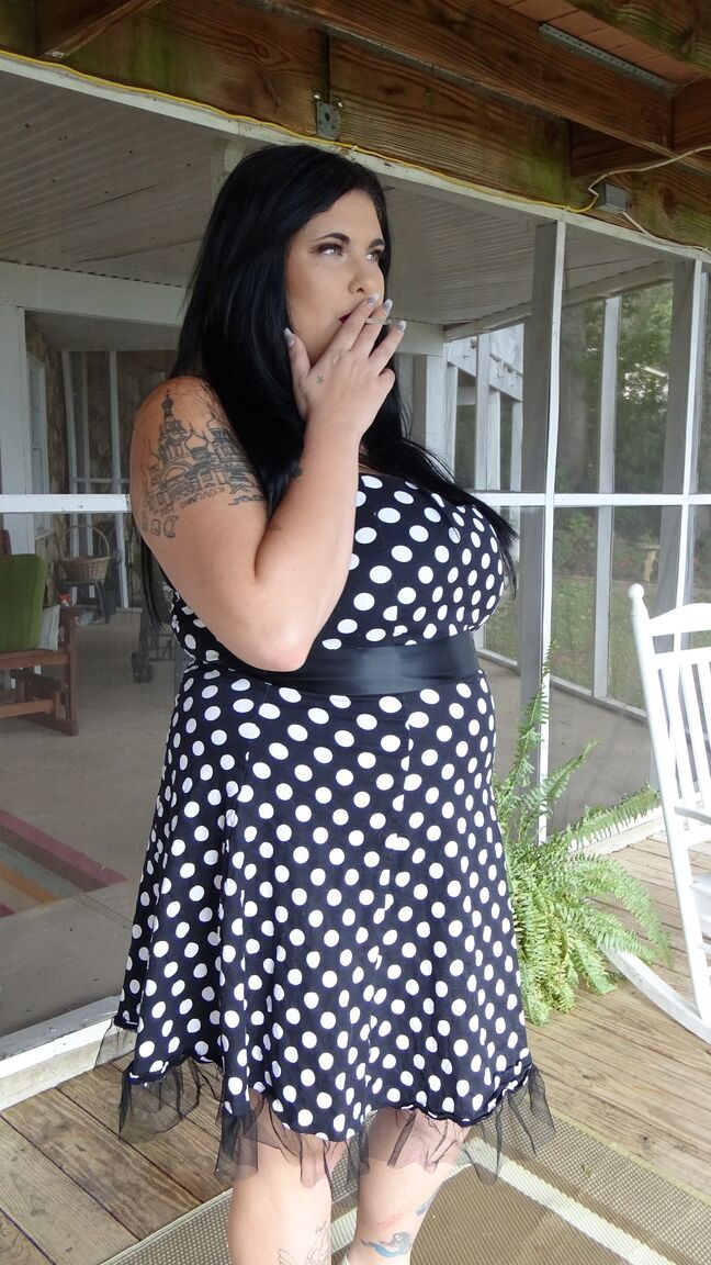 15P Dark haired chubby model Mischievous Kitty flashes her undies in a solo