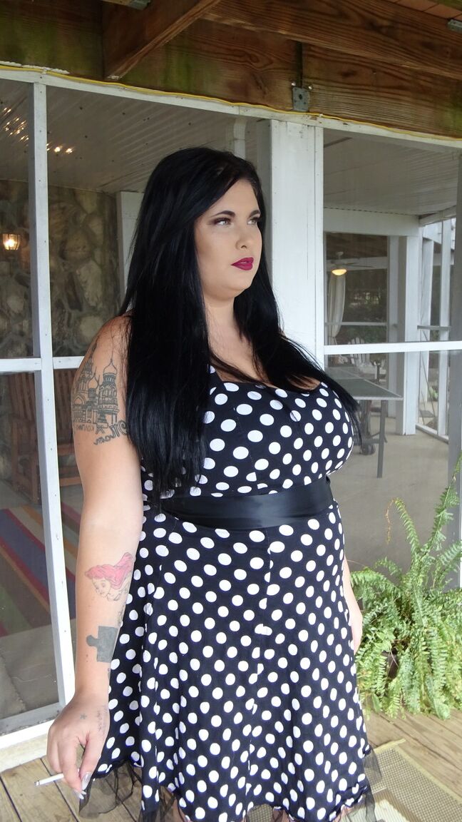 15P Dark haired chubby model Mischievous Kitty flashes her undies in a solo