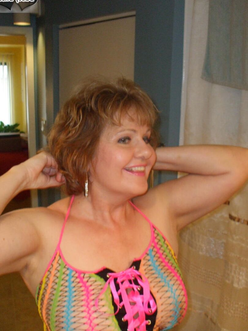 20P Older redhead Busty Bliss sucks the jizz from a cock during POV action