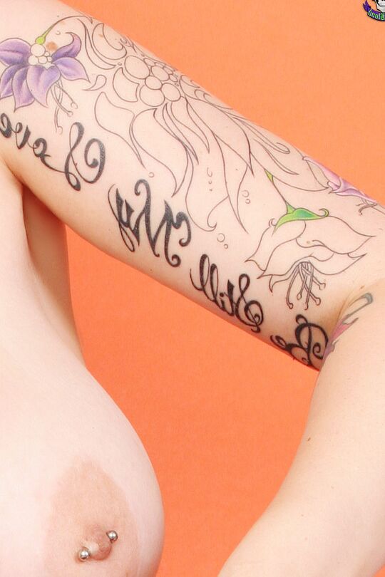 15P Big titted alt girl Xanthia Doll carves a pumpkin while naked in leg warmers