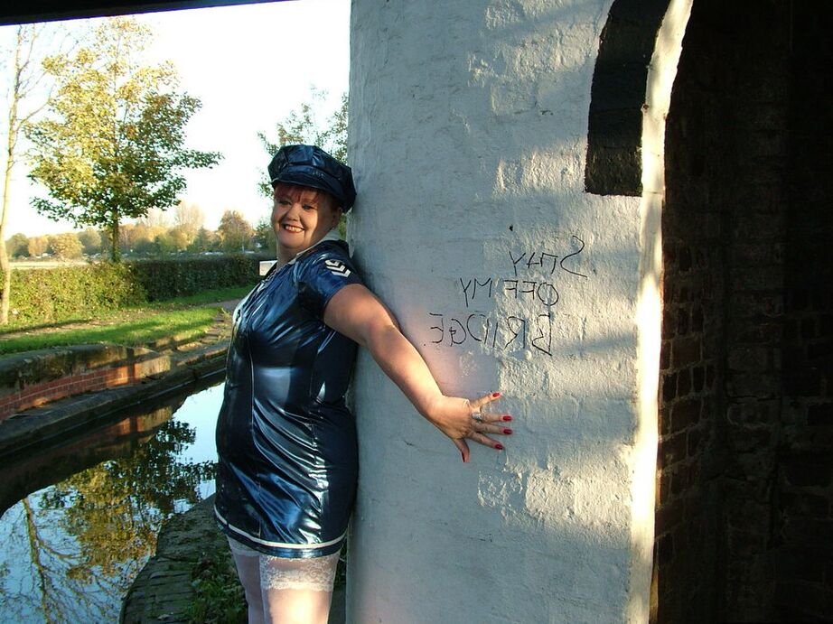 20P Older redhead Valgasmic Exposed exposes herself by a canal in a police uniform