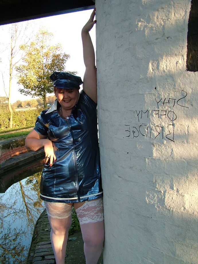 20P Older redhead Valgasmic Exposed exposes herself by a canal in a police uniform