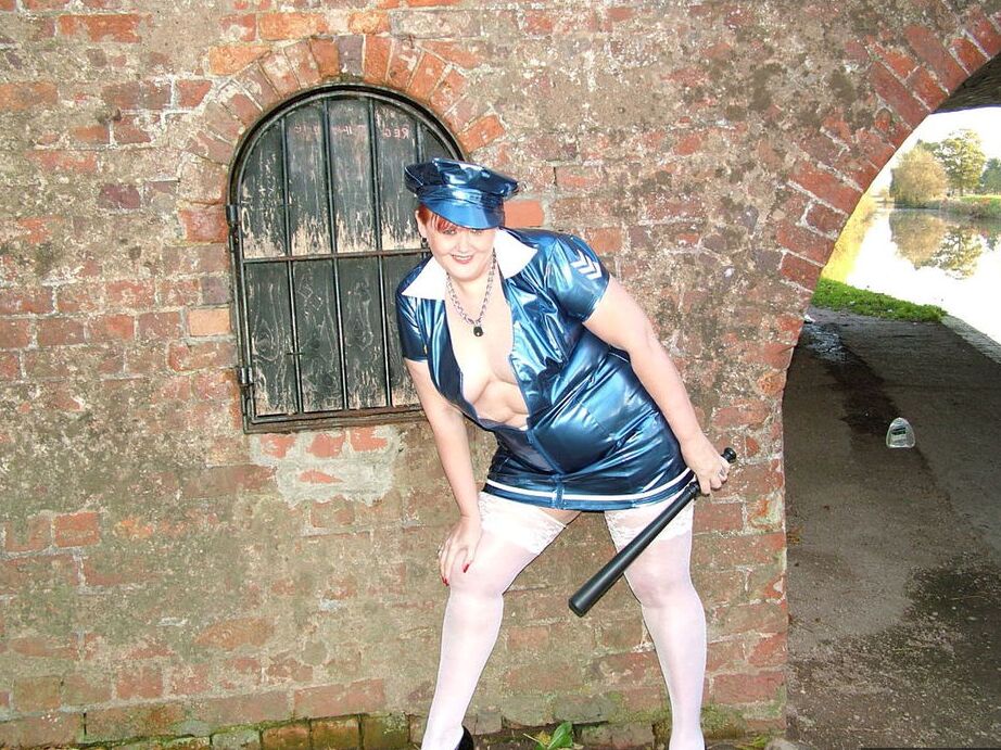 20P Older redhead Valgasmic Exposed exposes herself by a canal in a police uniform