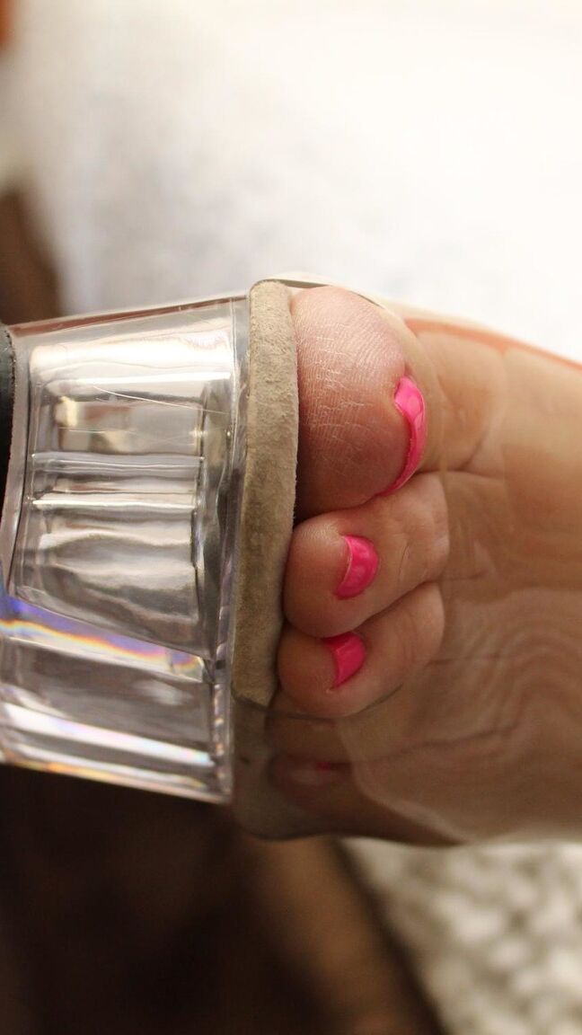 12P Redheaded plumper Ginger Reigh displays her painted toenails in a red dress