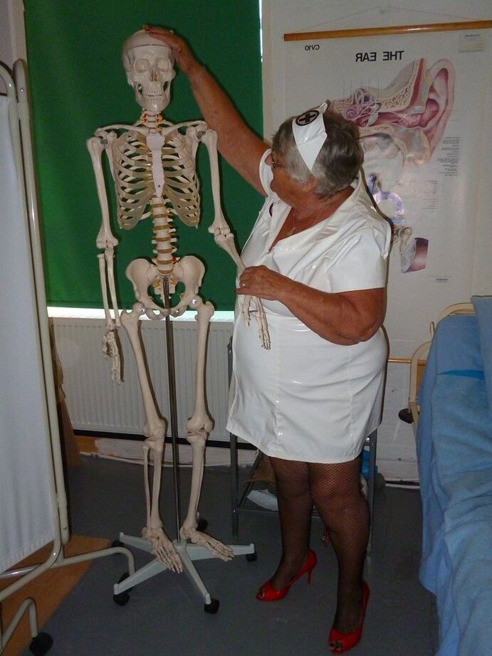 20P Fat old nurse Grandma Libby attaches a dildo to a skeleton for sexual relief