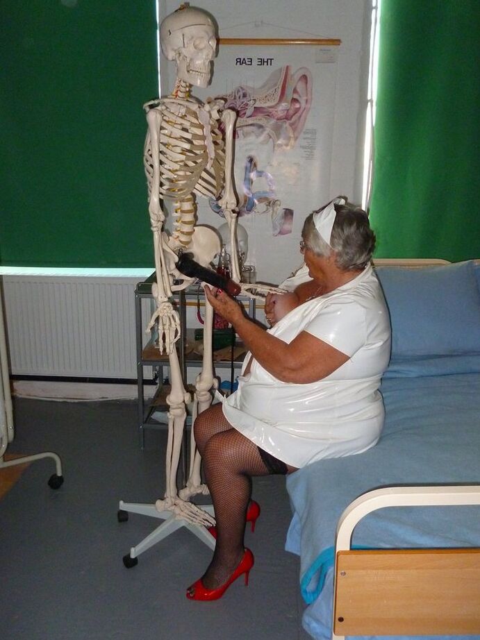 20P Fat old nurse Grandma Libby attaches a dildo to a skeleton for sexual relief