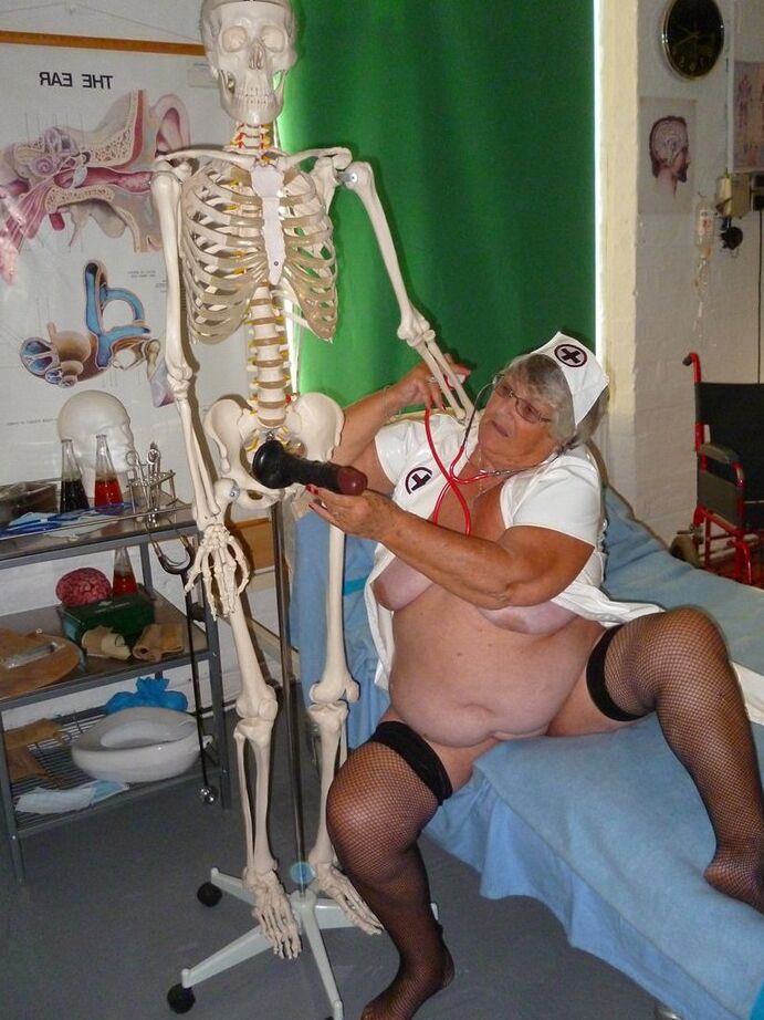 20P Fat old nurse Grandma Libby attaches a dildo to a skeleton for sexual relief