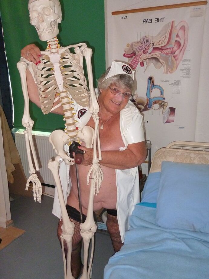 20P Fat old nurse Grandma Libby attaches a dildo to a skeleton for sexual relief