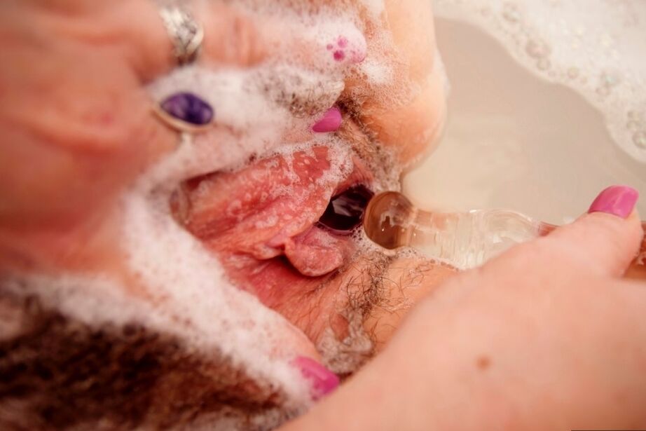 20P Big titted British woman Juicey Janey dildos her beaver while taking a bath