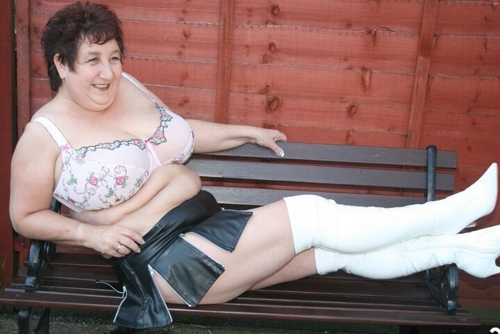 16P Fat older woman Kinky Carol models a bra and microskirt in over the knee boots